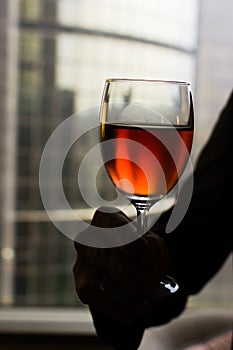 Sommelier holding a glass of wine