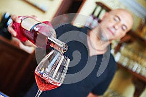 Sommelier pouring wine