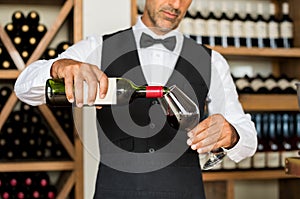 Sommelier pouring wine