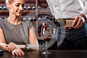 Sommelier with young woman on degustation in the photo