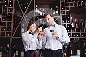 Sommeliers holding glasses of wine while