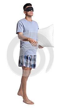 Somnambulist with blindfold and soft pillow on white background. Sleepwalking