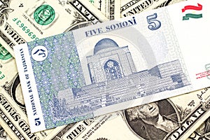 A somoni note from Tajikistan with American one dollar bills