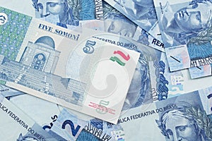 A somoni note from Tajikistan with Brazilian two reais bank notes