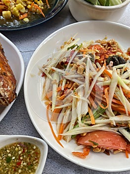 Somtam or Spicy green papaya salad Thai cuisine spicy delicious.