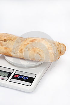 Somun bun and a rolling pin on the kitchen digital scale