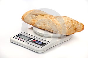 Somun bun and a rolling pin on the kitchen digital scale