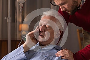 Son caring about dying father