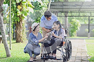 Son and daughter in law looking after elderly mother