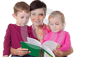 Son and daughter listening their mother reading book