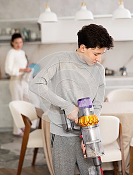 Son doing household chores