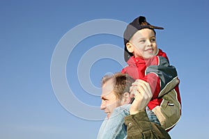 Son on father shoulders