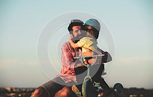 Son hugging Father. Daddy and child playing on summer vacation. Love, fatherhood and family concept. Father& x27;s Day