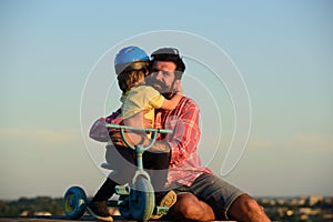 Son hugging Father. Daddy and child playing on summer vacation. Love, fatherhood and family concept. Father`s Day. Child