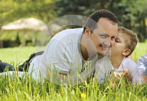 Son kissing his father outdoor