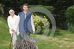 Son pushing wheel-barrow