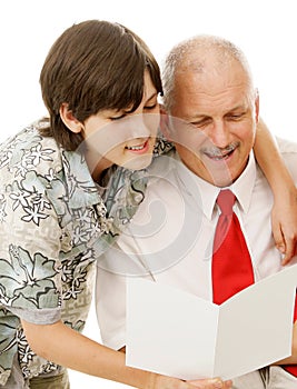 Son Reads Greeting Card to Dad