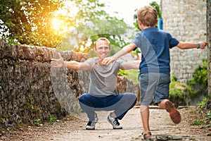 Son runs to his father hugs