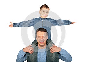 Son sits on father`s shoulders