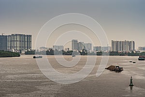 Song Sai Gon River with high rise buildings behind, Ho Chi Minh City, Vietnam