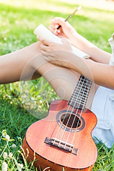 Song writer with little guitar