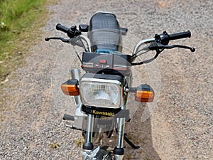 Songkhla, Thailand, October 10, 2021 - Kawasaki GTO Mach-4 Blue color on gravel road