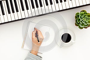songwriter or dj work place with synthesizer
