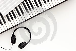 Songwriter or dj work place with synthesizer and headphones