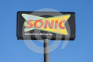 Sonic America's Drive-In elevated sign with logo an Inspire Brands location