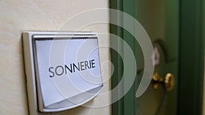 Sonnerie word written on door bell, apartment rental service, hospitality photo