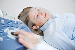 Sonogram procedure to pregnant woman.