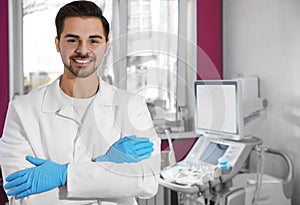 Sonographer near modern ultrasound machine in clinic