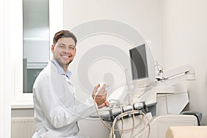 Sonographer operating modern ultrasound machine