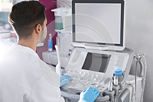 Sonographer using modern ultrasound machine