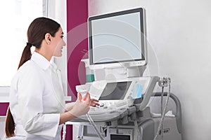 Sonographer using modern ultrasound machine