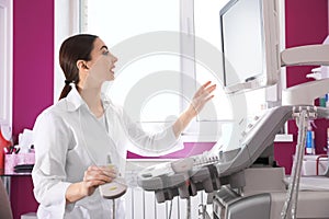Sonographer using modern ultrasound machine