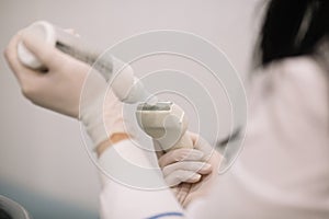 Sonographer using ultrasound machine