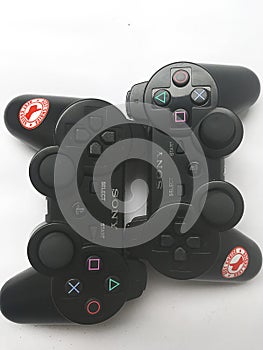 Sony Black PlayStation game controller on white background