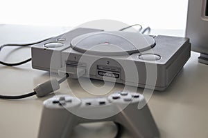 A sony Playstation one and controller a games console released in 1994 by sony