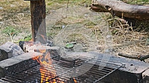 Soot Kettle is Boiling Water Over Self-Made Tourist Stove in Nature