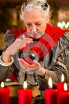 Soothsayer during session with crystal ball