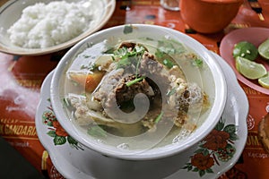 Sop buntut or oxtail soup. Indonesian traditional culinary photo