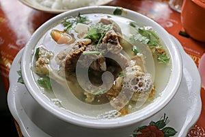 Sop buntut or oxtail soup. Indonesian traditional culinary photo