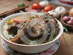 Sop Buntut or Sop Tulang Sapi, Indonesian Oxtail Soup photo