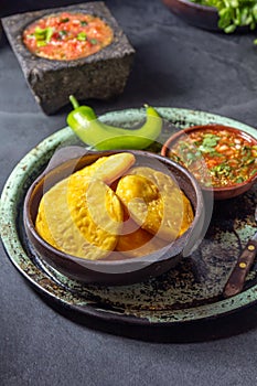 Sopaipilla. Latin American food. Traditional chilean homemade pumpkin sopaipillas with typical salsas - chancho en