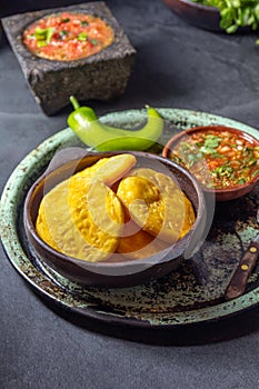 Sopaipilla. Latin American food. Traditional chilean homemade pumpkin sopaipillas with typical salsas - chancho en photo