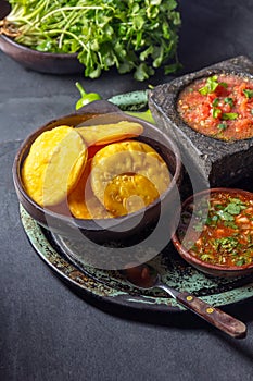 Sopaipilla. Latin American food. Traditional chilean homemade pumpkin sopaipillas with typical salsas - chancho en photo