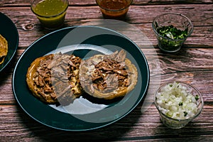 Sope pocho, typical Mexican food served with condiments