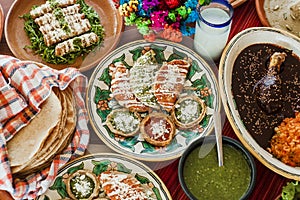 Sopes, tacos dorados and flautas de pollo, Mexican food, spicy sauce in Mexico photo