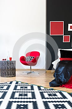 Sophisticated bedroom with red furniture